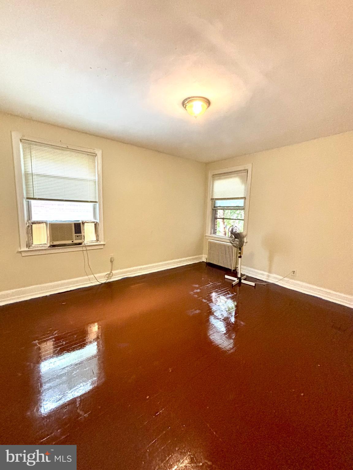 5510 1st Street Northwest, Unit 6 Washington, DC 20011 - Photo 5 of 6 an empty room with wooden floor and windows