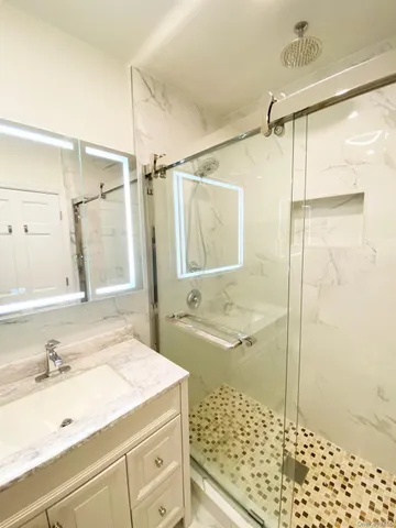 a bathroom with a sink and a shower