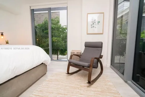 a kitchen with a sink and large window