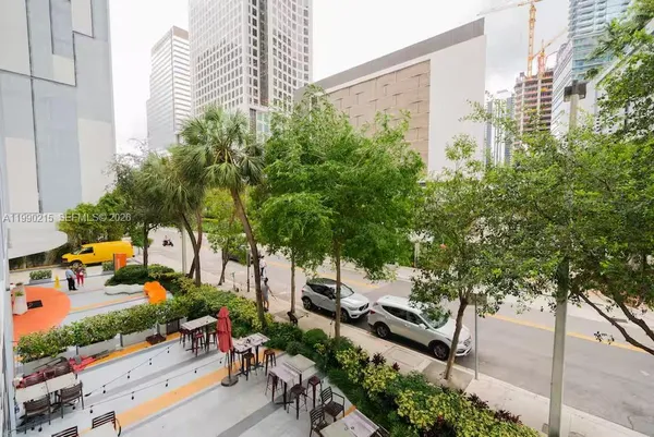 a kitchen with stainless steel appliances a sink and a refrigerator