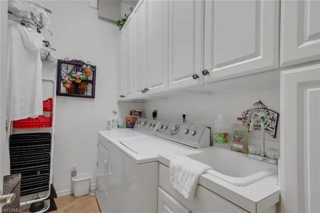 a dining room with furniture a chandelier and wooden floor