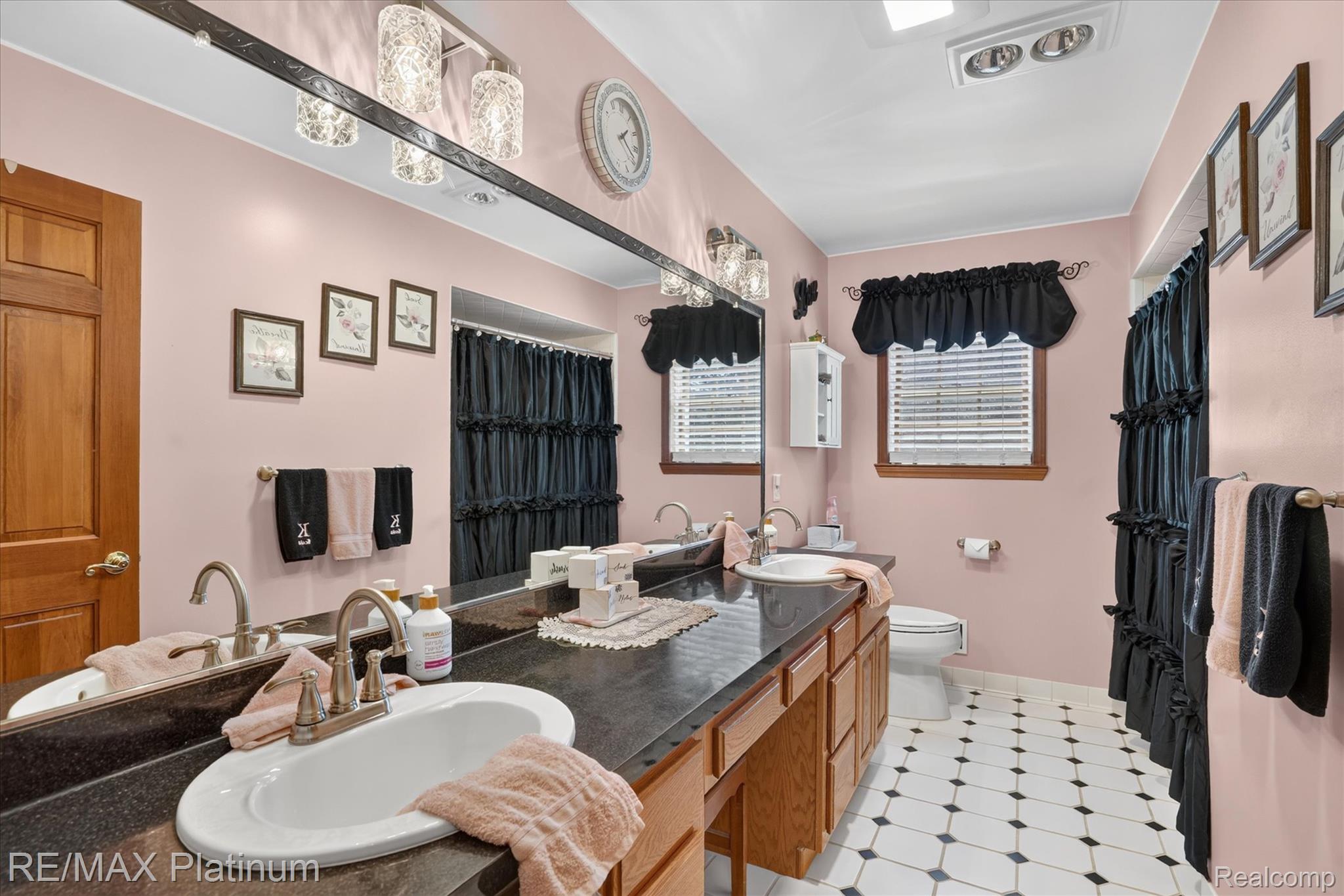 4457 Bradley Road Gregory, MI 48137 - Photo 24 of 79 Dual vanity with dark countertops and undermount sinks