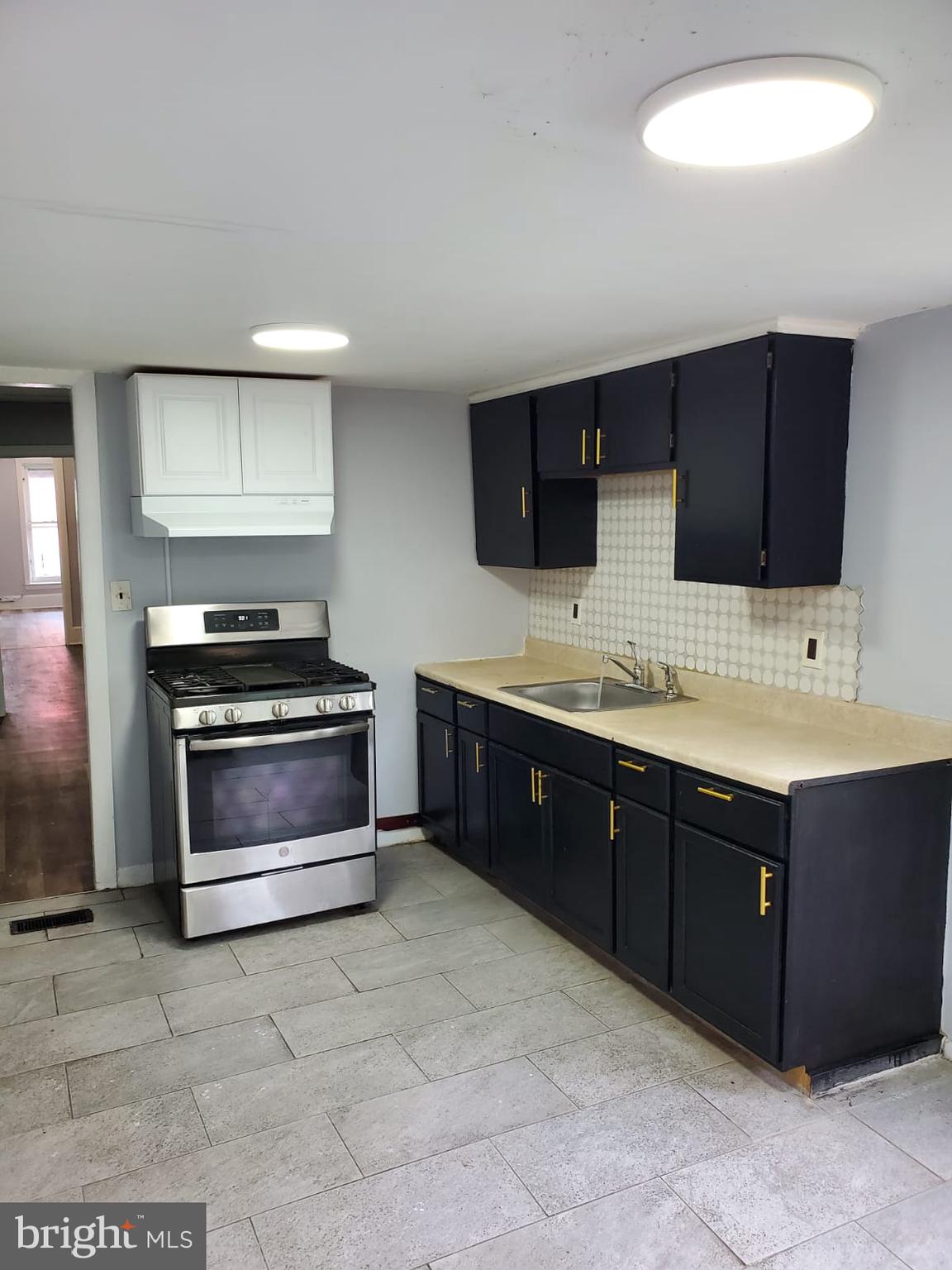 68 End Trenton, NJ 08618 - Photo 2 of 5 a spacious bathroom with a sink and a microwave
