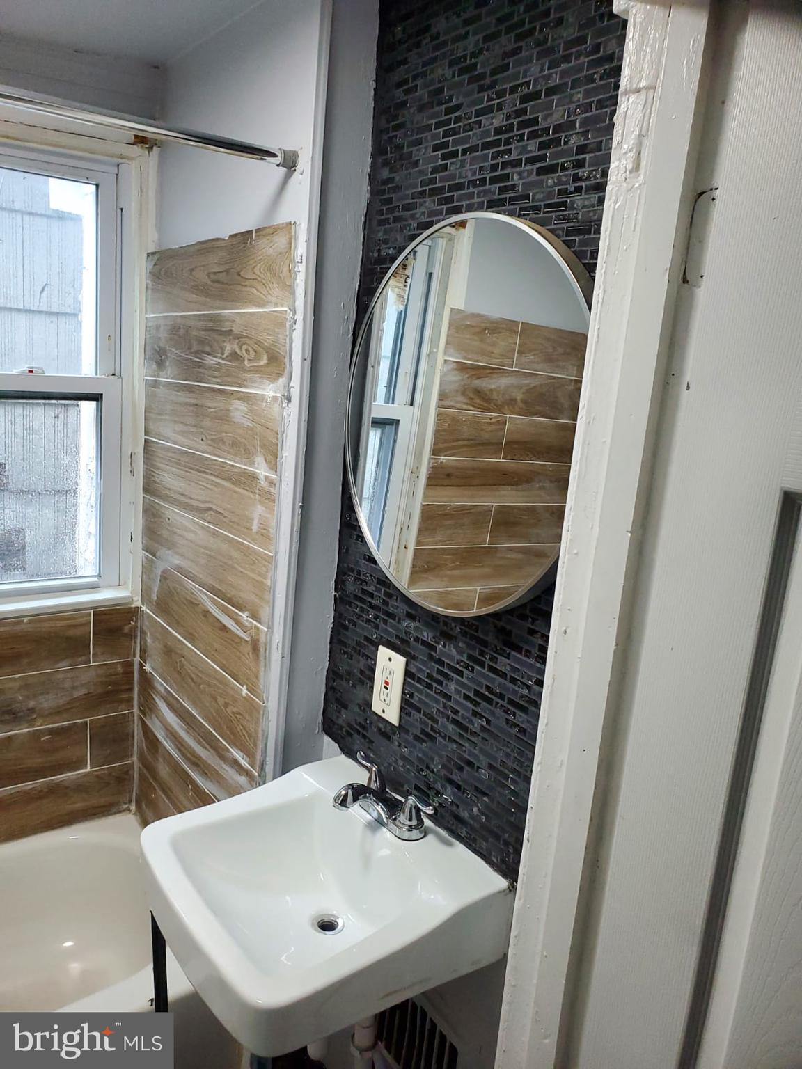 68 End Trenton, NJ 08618 - Photo 5 of 5 a bathroom with a sink and a mirror