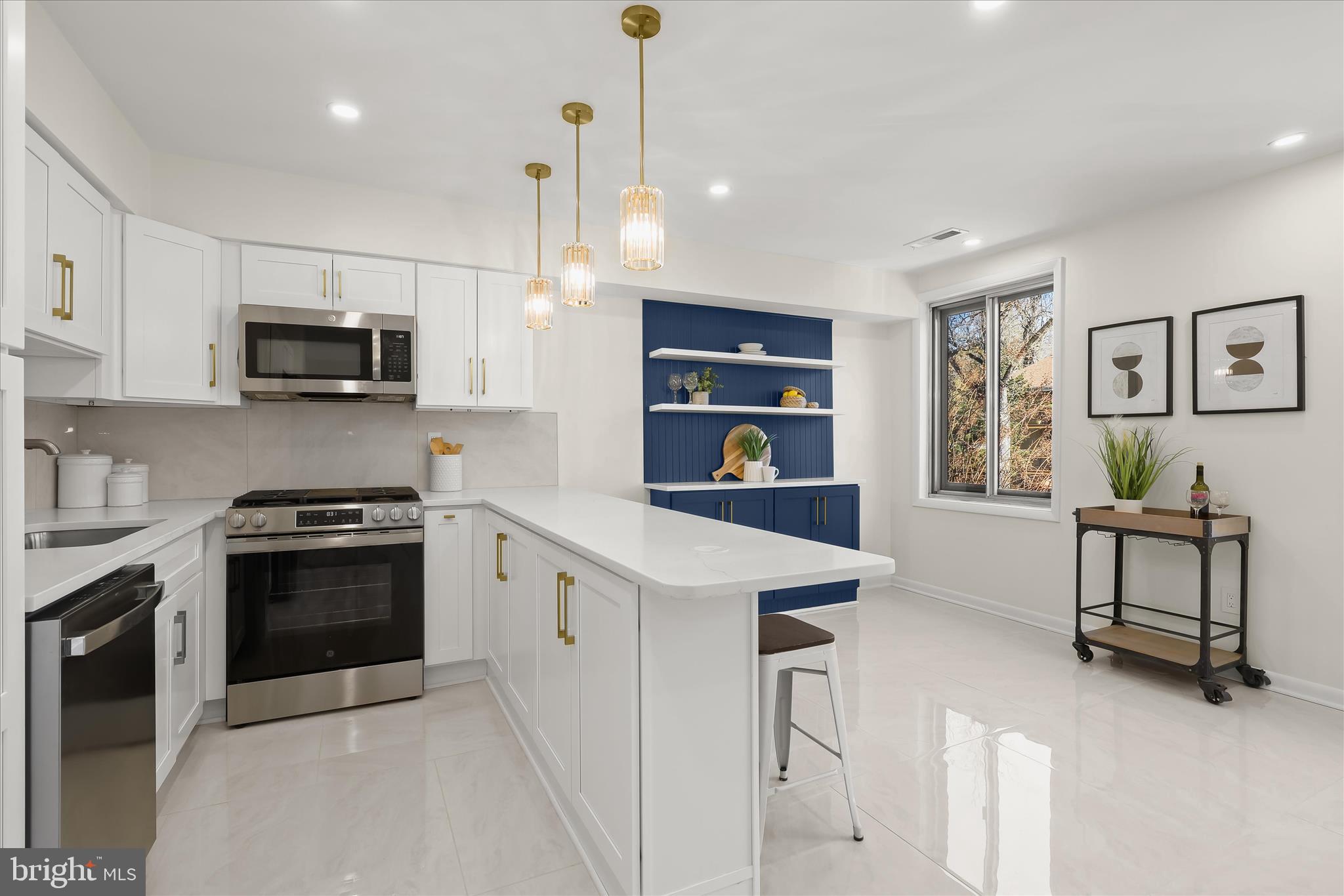 2 Cross Keys Road, Unit 2F Baltimore, MD 21210 - Photo 14 of 36 a kitchen with stainless steel appliances granite countertop a stove and a refrigerator