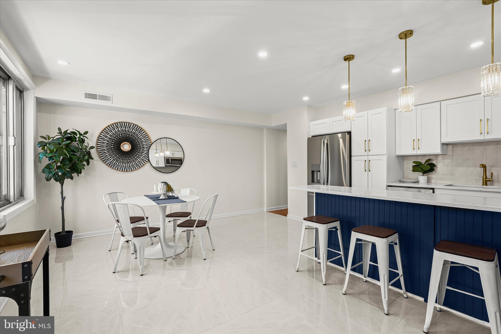 2 Cross Keys Road, Unit 2F Baltimore, MD 21210 - Photo 15 of 36 an open kitchen with dining table and chairs