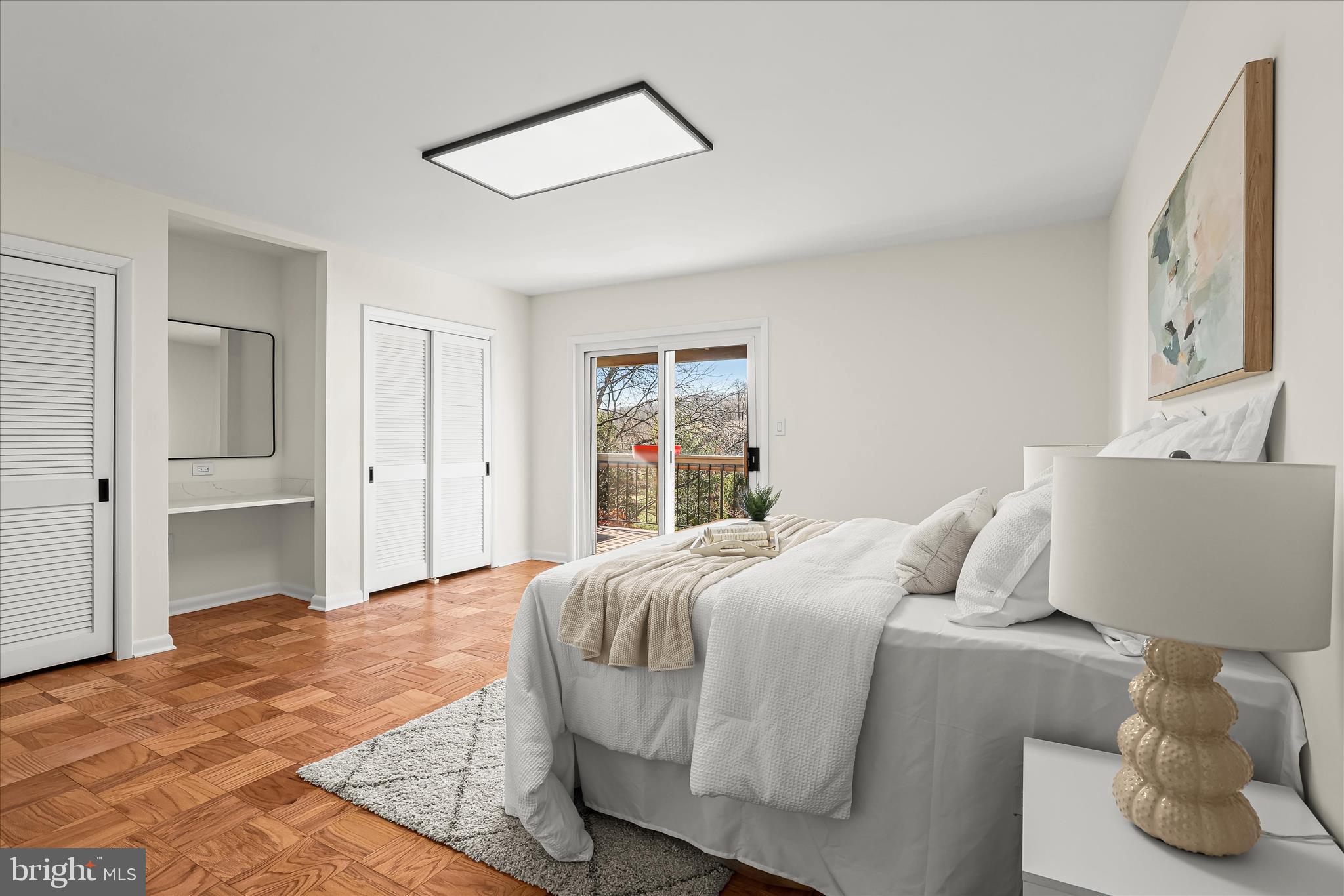 2 Cross Keys Road, Unit 2F Baltimore, MD 21210 - Photo 19 of 36 a bedroom with a bed and a large mirror