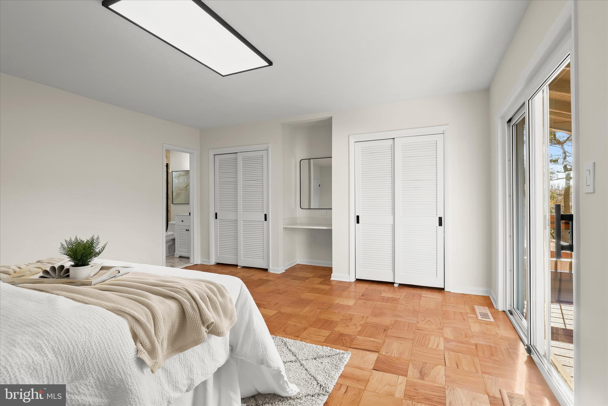 2 Cross Keys Road, Unit 2F Baltimore, MD 21210 - Photo 20 of 36 a bedroom with a bed and a chandelier