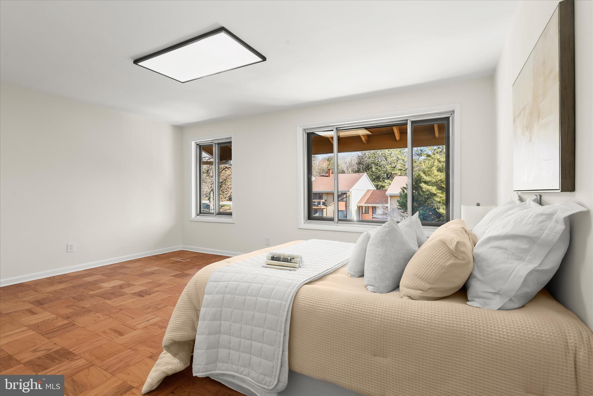 2 Cross Keys Road, Unit 2F Baltimore, MD 21210 - Photo 26 of 36 a bedroom with a large bed and a window