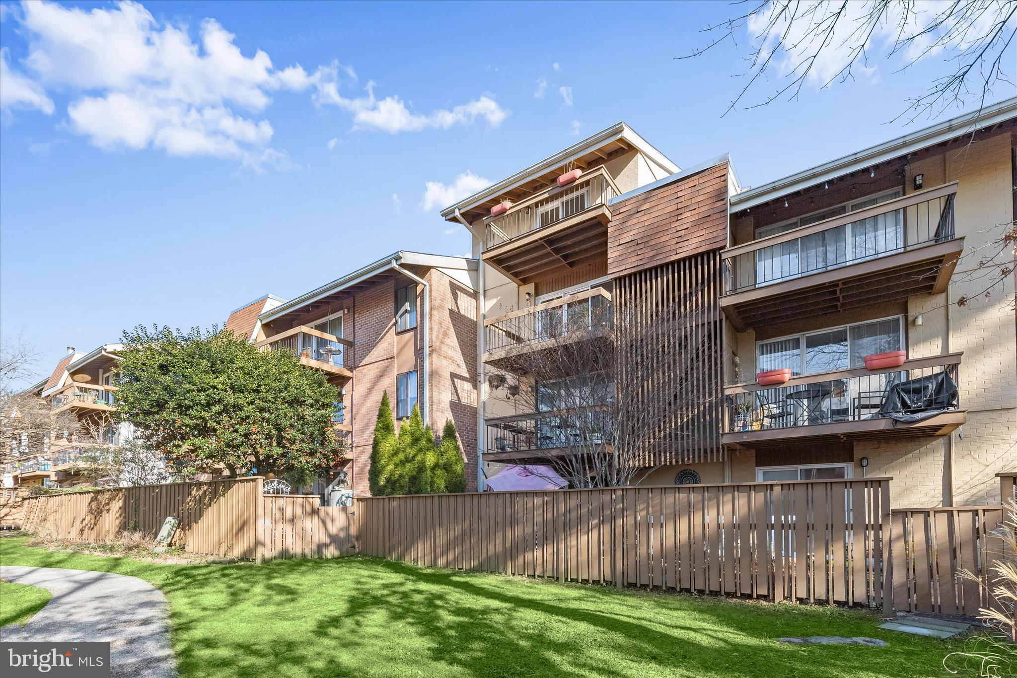 2 Cross Keys Road, Unit 2F Baltimore, MD 21210 - Photo 30 of 36 a front view of a house with a yard