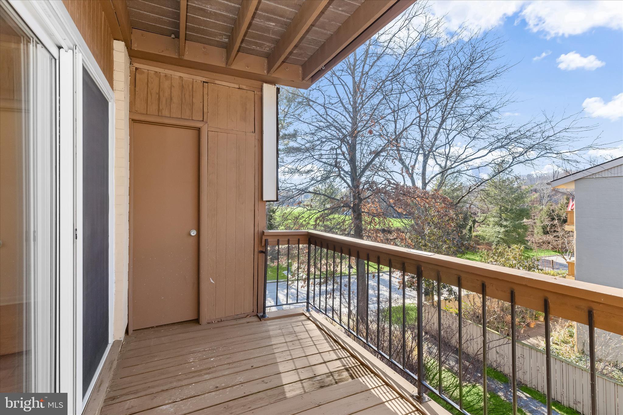 2 Cross Keys Road, Unit 2F Baltimore, MD 21210 - Photo 10 of 36 a view of a balcony with wooden floor