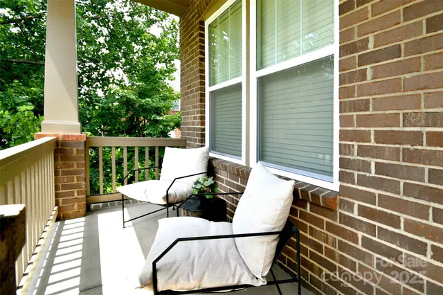 a view of balcony with wooden floor
