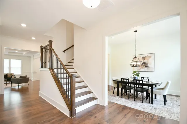 a view of dining room and hall with wooden floor