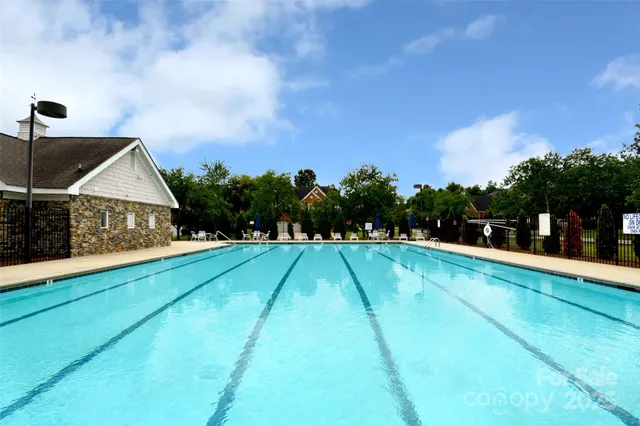 a view of swimming pool with a yard