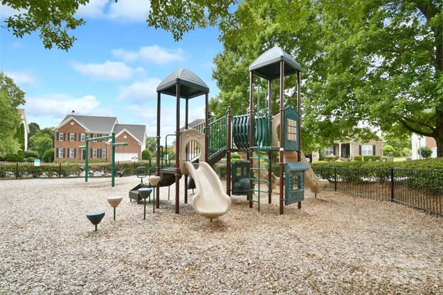 a view of a park with swings and slides