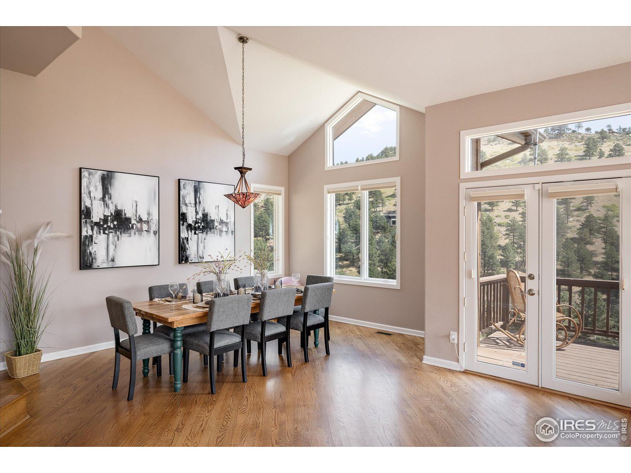 5251 Olde Stage Road Boulder, CO 80302 - Photo 10 of 39 a view of a dining room with furniture and wooden floor