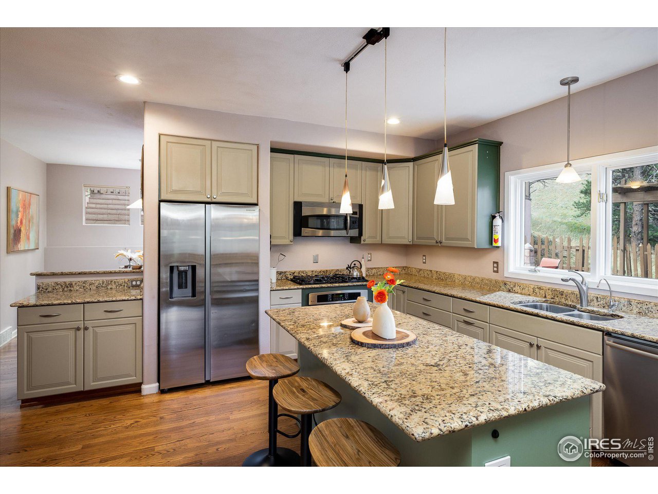 5251 Olde Stage Road Boulder, CO 80302 - Photo 11 of 39 a kitchen with stainless steel appliances granite countertop a sink refrigerator and microwave