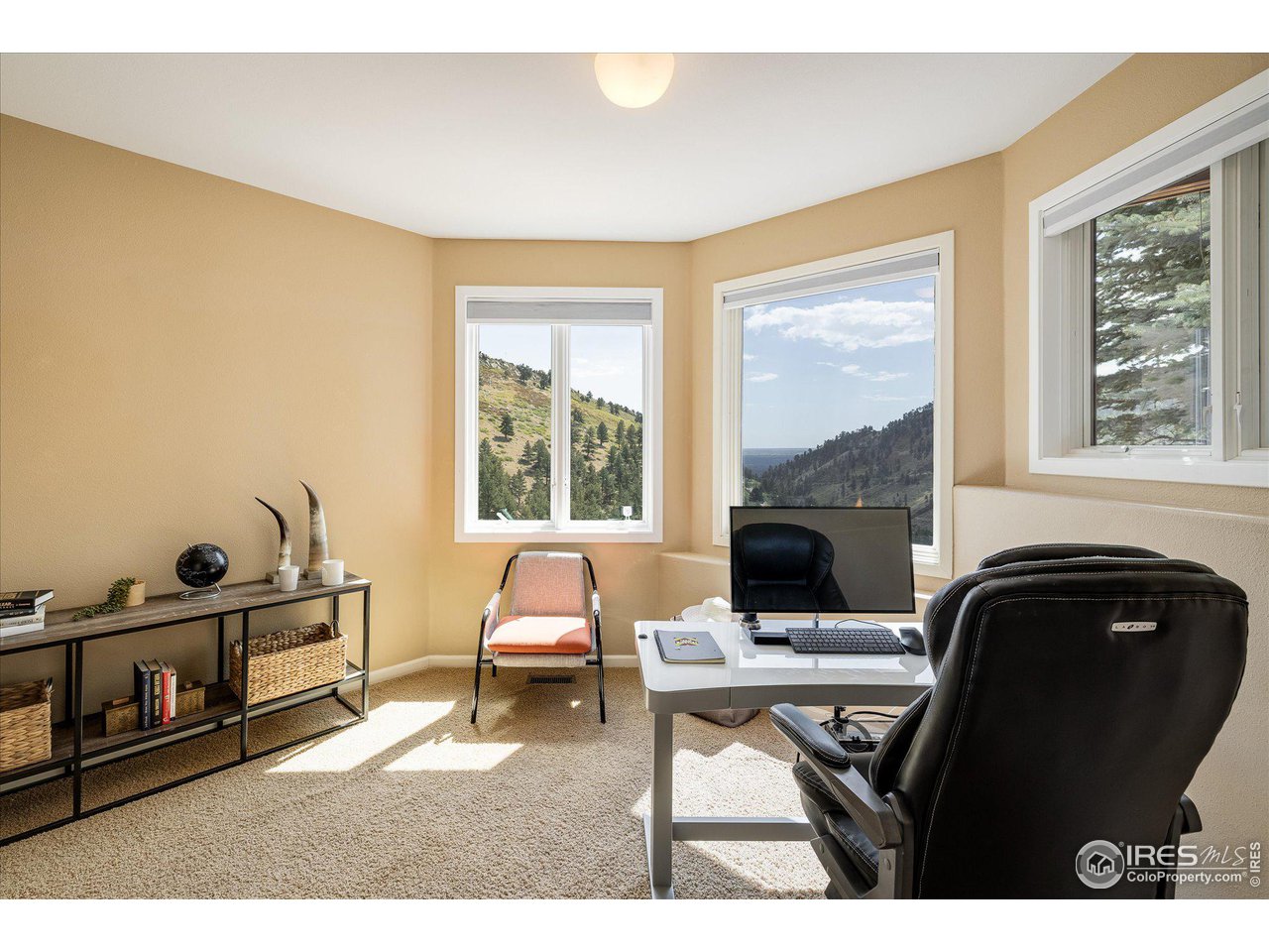 5251 Olde Stage Road Boulder, CO 80302 - Photo 14 of 39 a living room with furniture a fireplace and a window