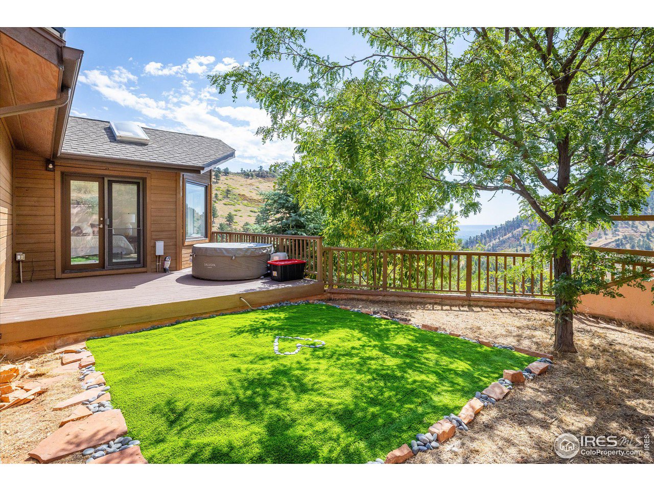 5251 Olde Stage Road Boulder, CO 80302 - Photo 16 of 39 a view of a house with backyard and a tree