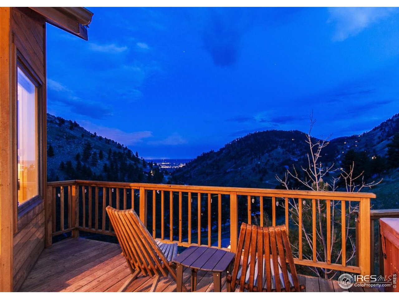 5251 Olde Stage Road Boulder, CO 80302 - Photo 17 of 39 a view of balcony with wooden floor and outdoor seating