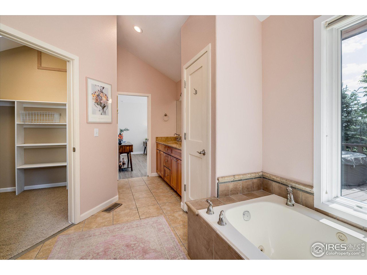 5251 Olde Stage Road Boulder, CO 80302 - Photo 22 of 39 a bathroom with a tub sink and a mirror