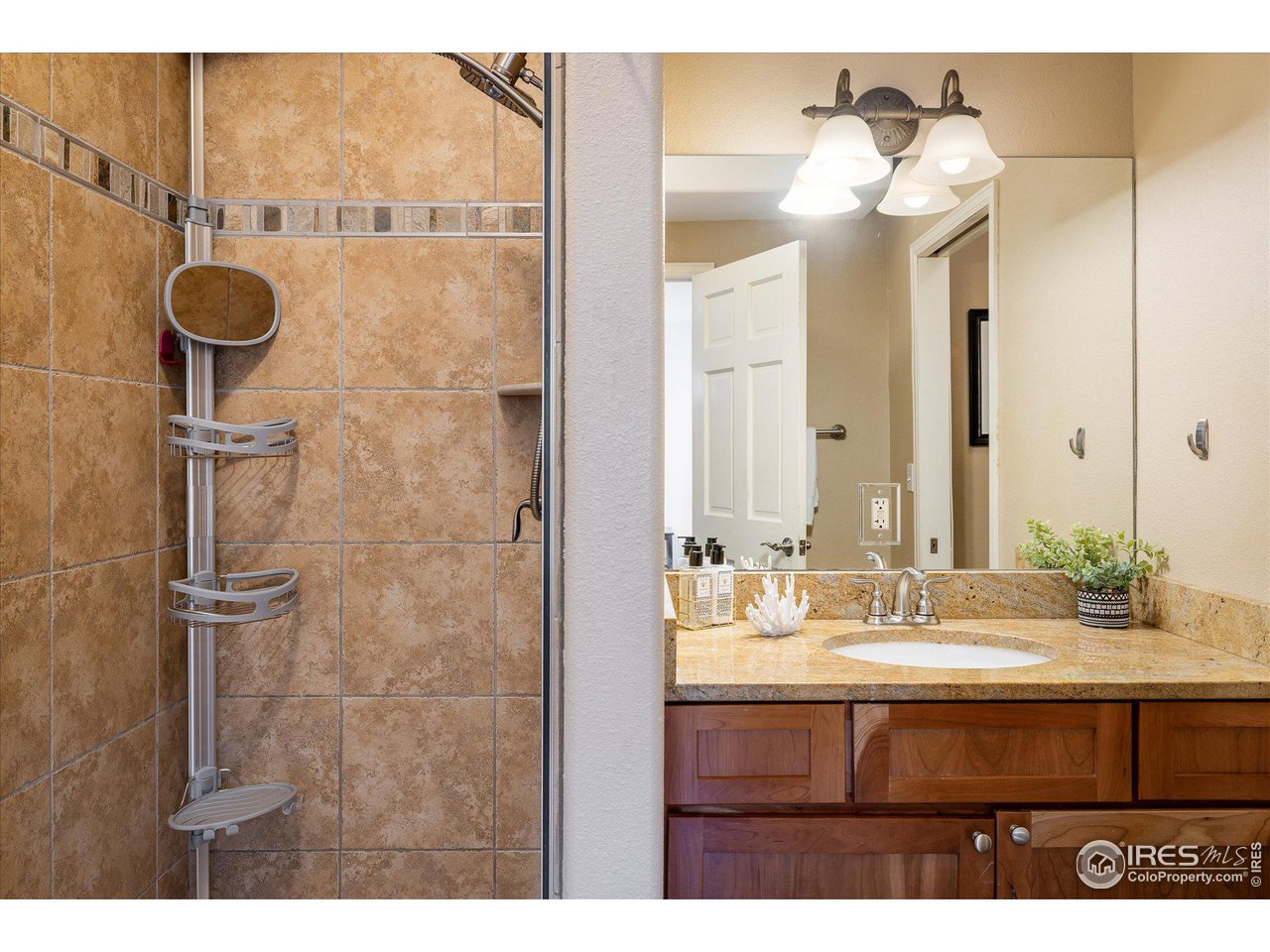 5251 Olde Stage Road Boulder, CO 80302 - Photo 23 of 39 a bathroom with a sink mirror and vanity