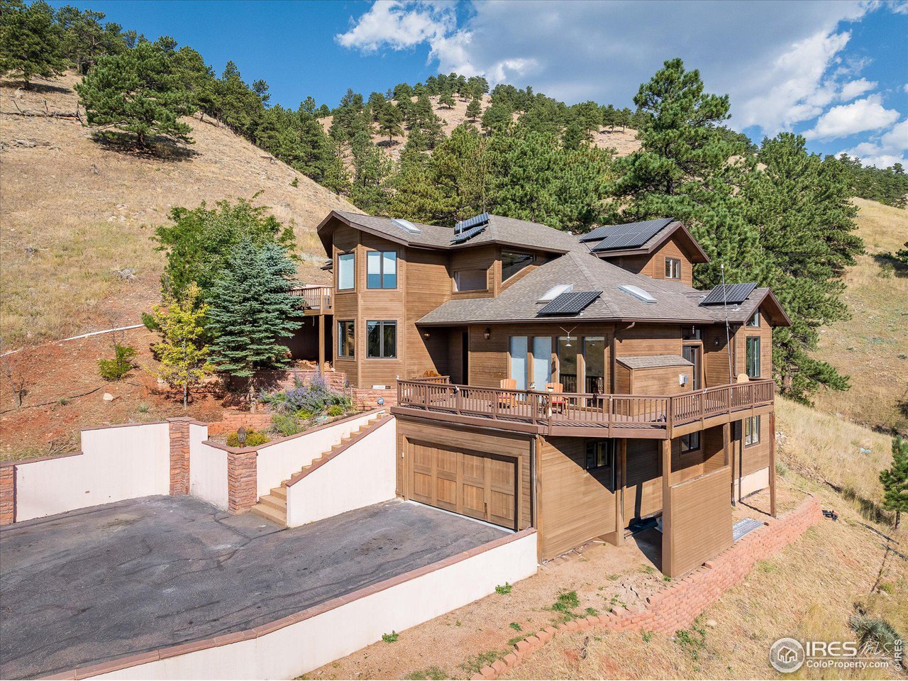 5251 Olde Stage Road Boulder, CO 80302 - Photo 34 of 39 a front view of a house with a yard and balcony