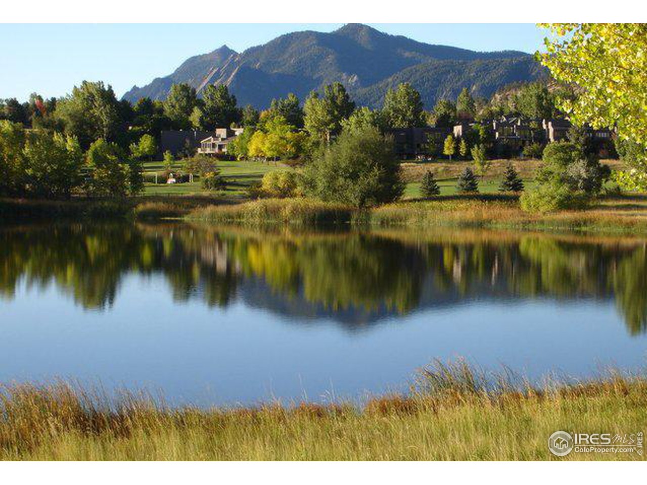 5251 Olde Stage Road Boulder, CO 80302 - Photo 37 of 39 a view of a lake with a mountain in the background
