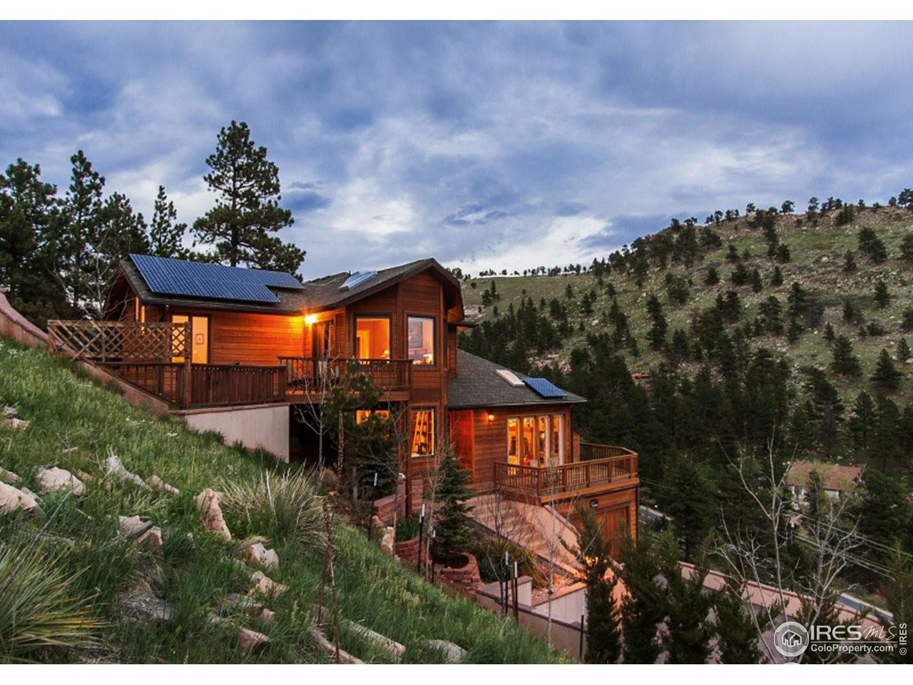 5251 Olde Stage Road Boulder, CO 80302 - Photo 5 of 39 a front view of a house with a yard