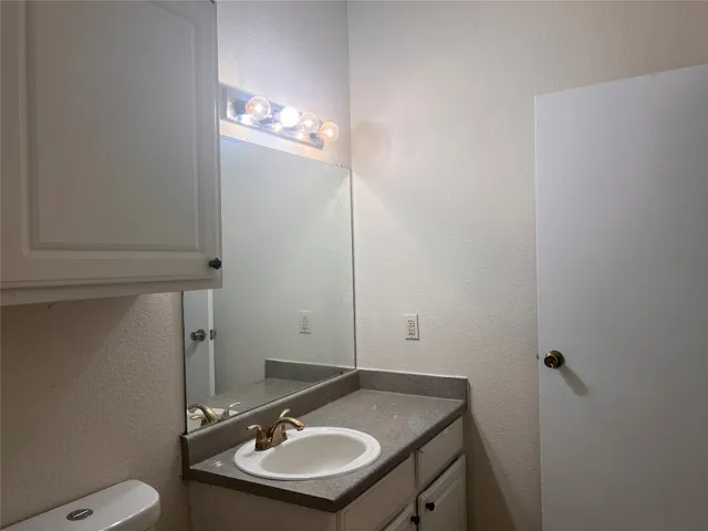 a bathroom with a sink and a toilet