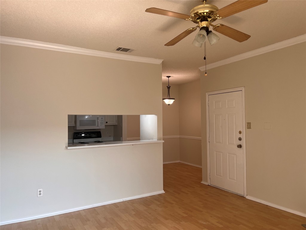 12166 Metric Boulevard, Unit 3007 Austin, TX 78758 - Photo 6 of 19 a view of a microwave and a microwave