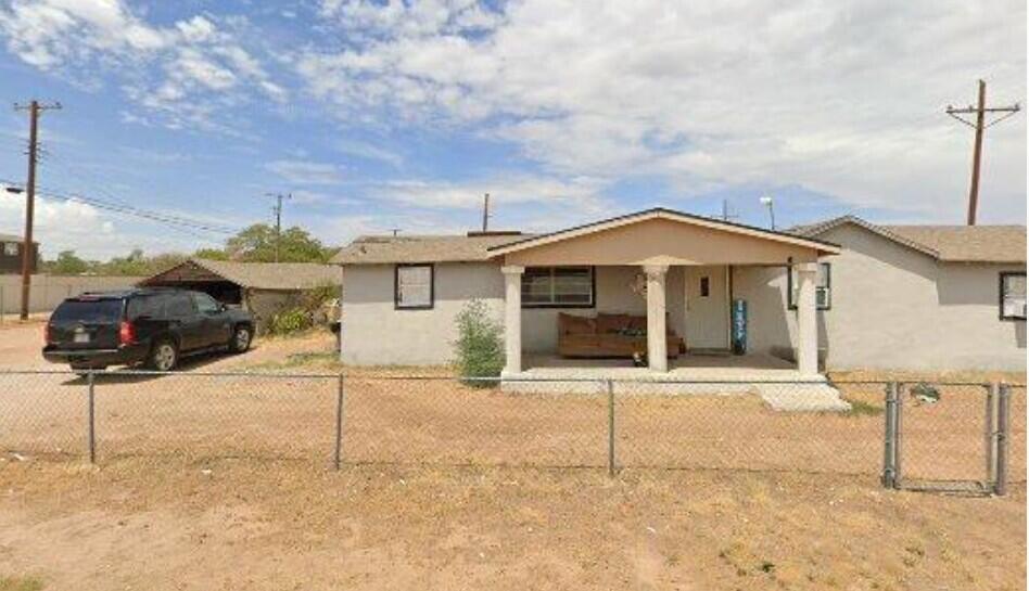 1255 South 7th Street Slaton, TX 79364 - Photo 1 of 1 a front view of a house with a yard
