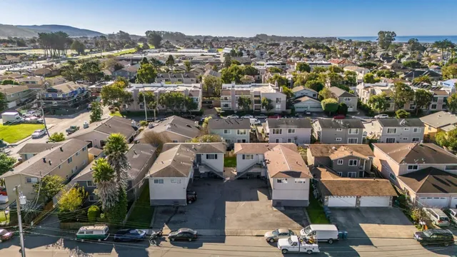 an aerial view of a house with a yard