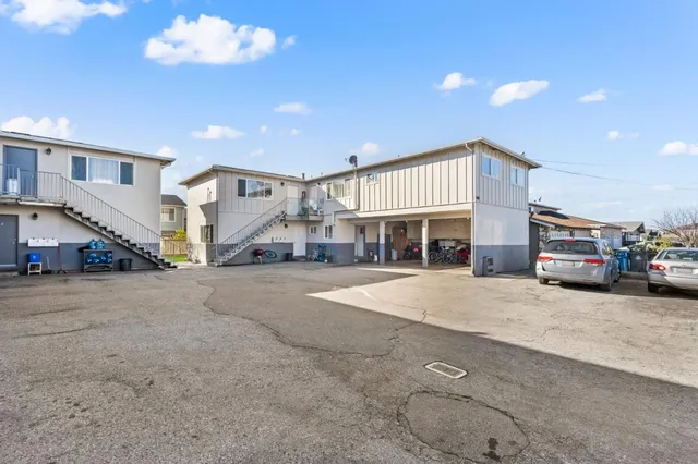 a living room with a couch and a chandelier