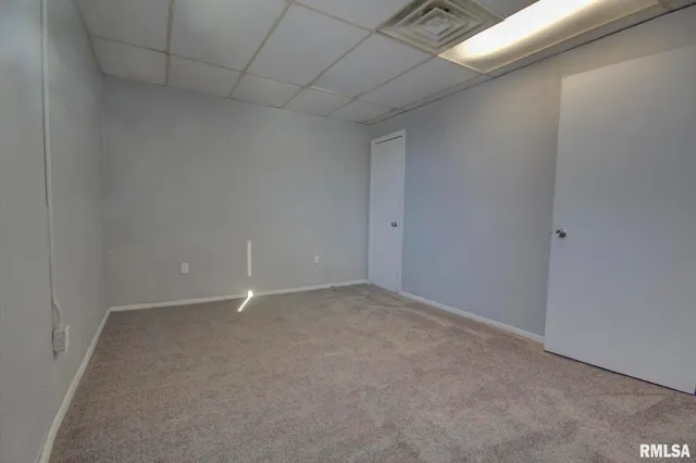 a view of a kitchen with a sink wooden floor and a window