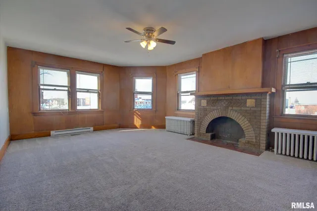 a view of empty room with fireplace