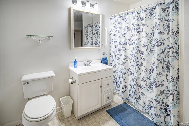 a bathroom with a toilet and a sink