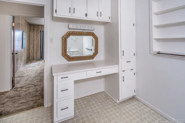 a view of cabinets a washer and dryer