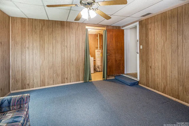 a view of empty room with ceiling fan