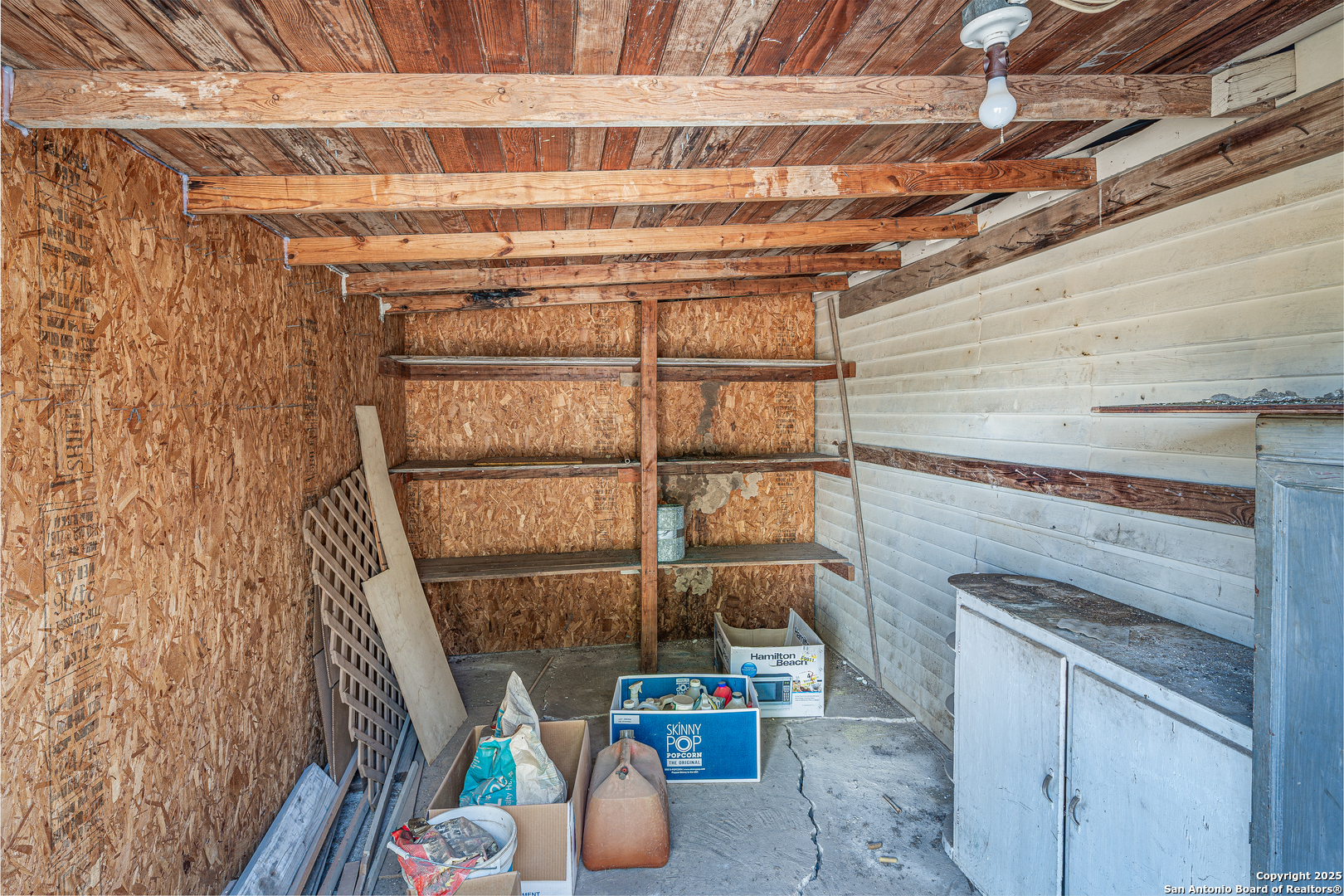 611 Austin Street Sabinal, TX 78881 - Photo 33 of 45 a storage room with washer and dryer