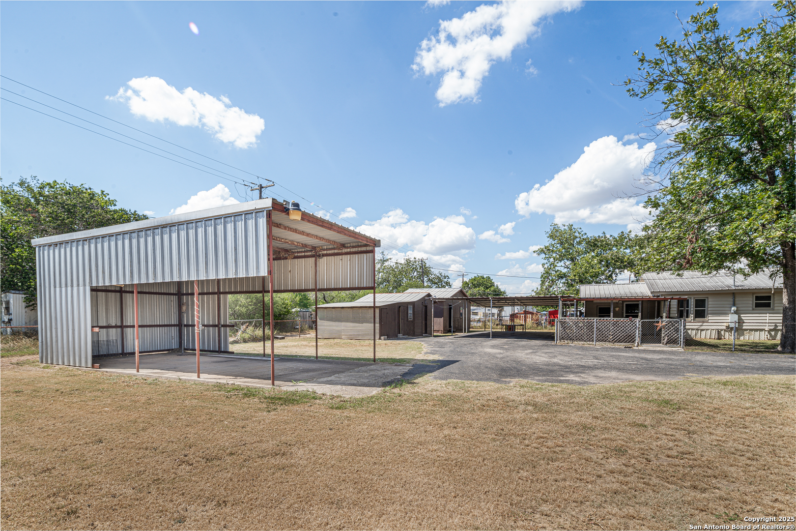 611 Austin Street Sabinal, TX 78881 - Photo 39 of 45 a view of a house with a patio