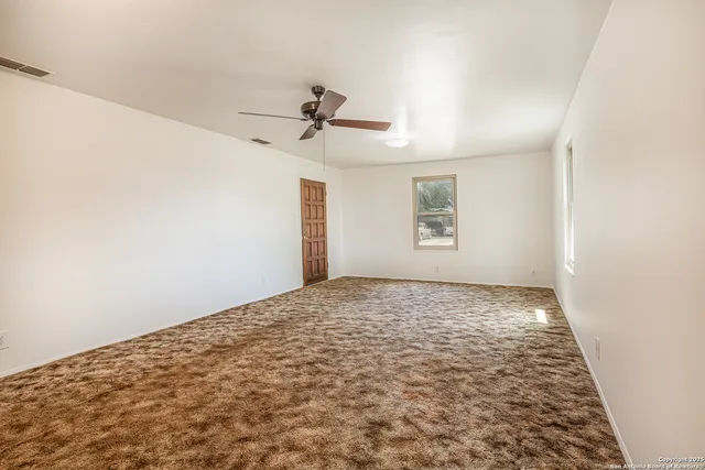 a view of a big room with natural light