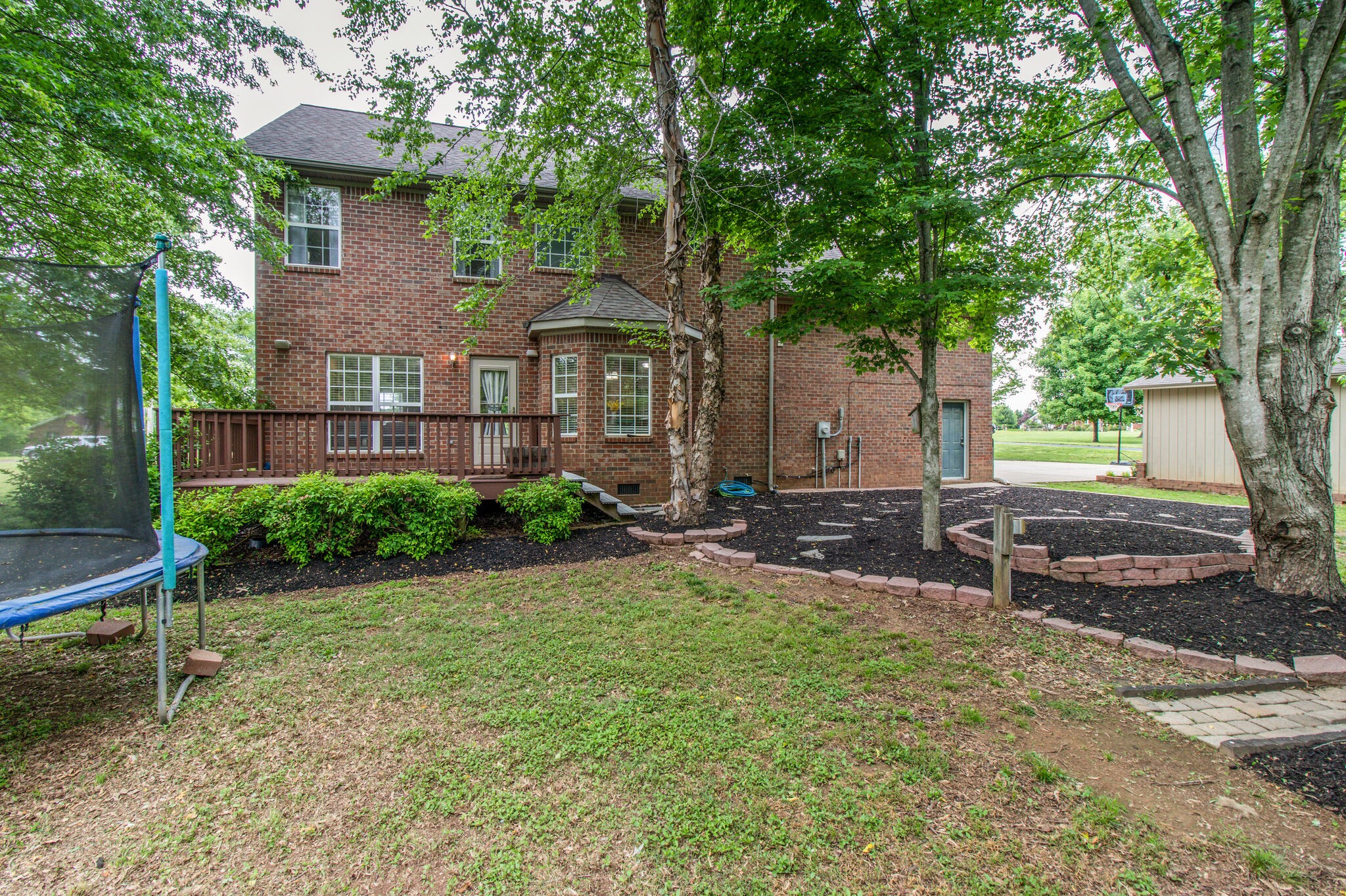 1933 Victorian Road Columbia, TN 38401 - Photo 19 of 20 a view of a brick house with a yard and large tree