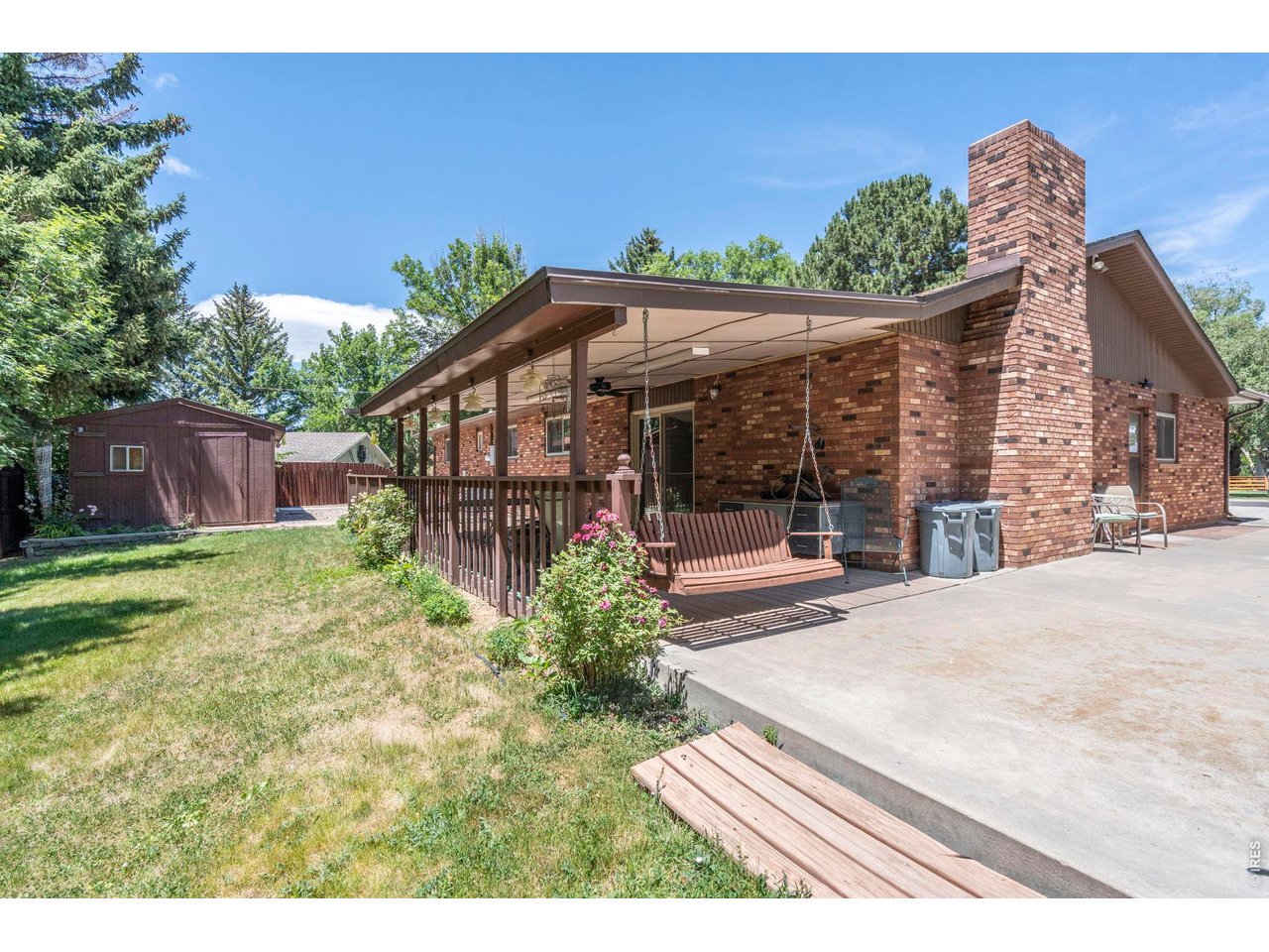300 Ranch Acres Drive Loveland, CO 80538 - Photo 26 of 38 a view of a house with backyard and sitting area