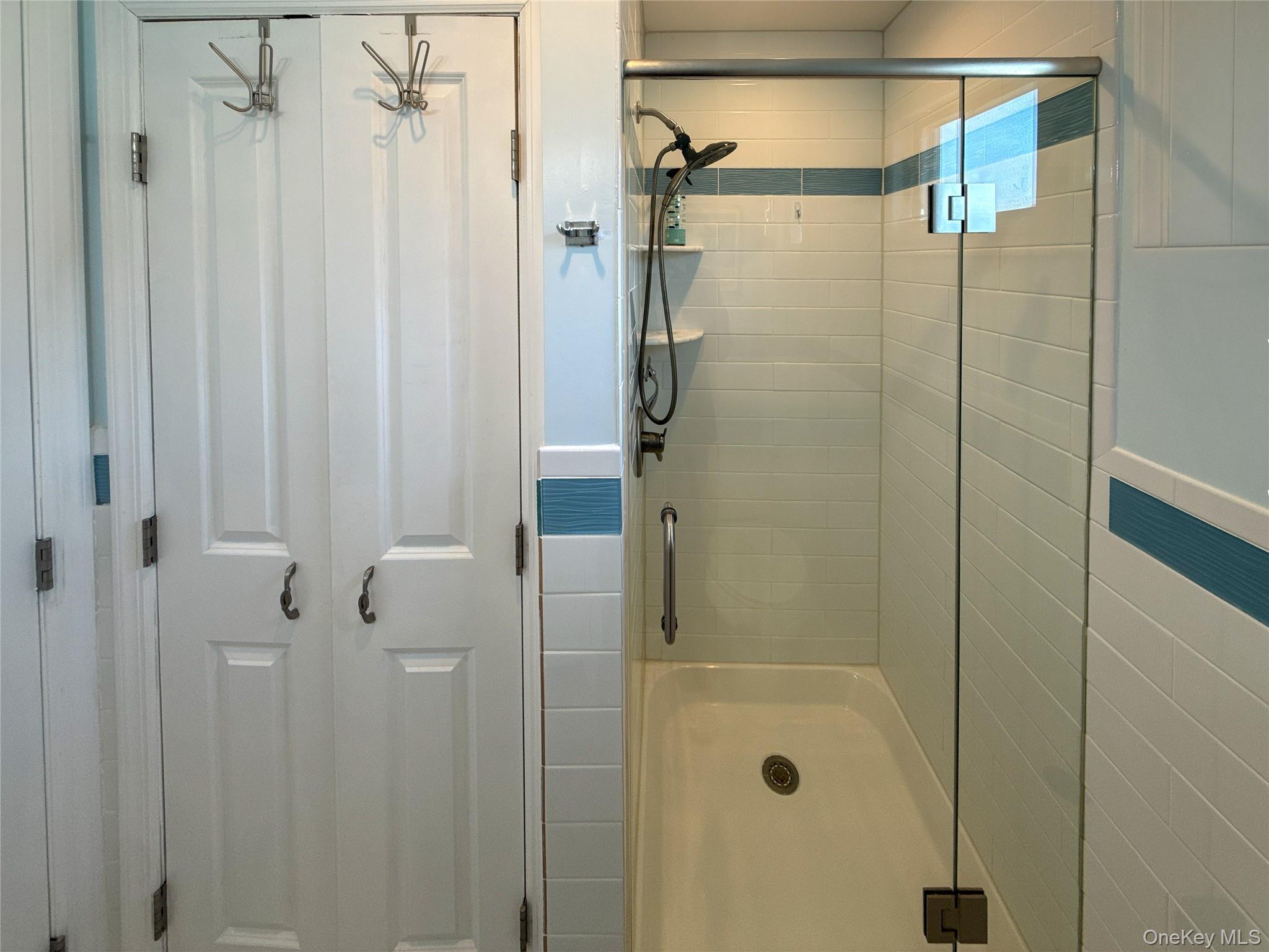97 Cedarhurst Avenue Point Lookout, NY 11569 - Photo 13 of 21 a bathroom with a shower