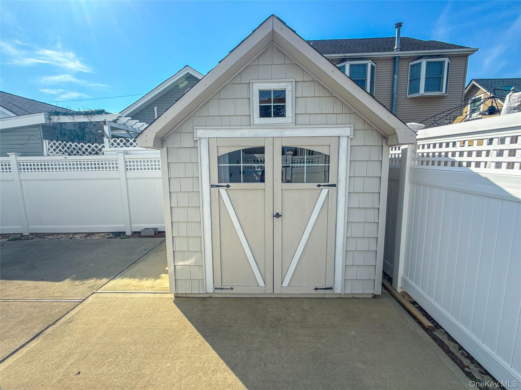 97 Cedarhurst Avenue Point Lookout, NY 11569 - Photo 19 of 21 a view of a house with a wooden deck