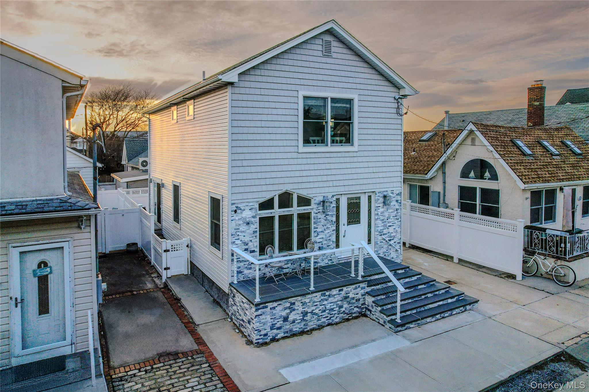 97 Cedarhurst Avenue Point Lookout, NY 11569 - Photo 2 of 21 a view of a house with a yard