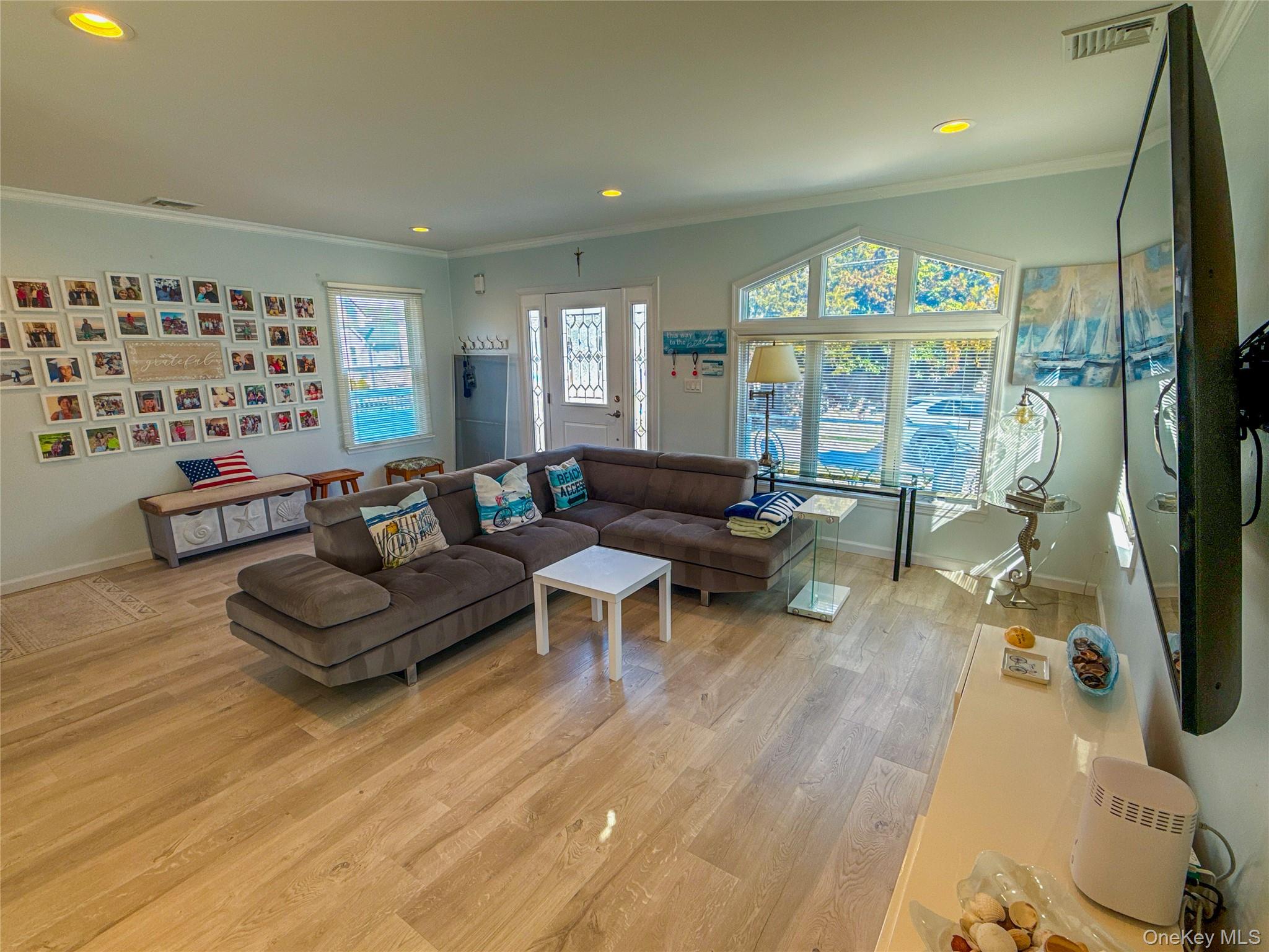 97 Cedarhurst Avenue Point Lookout, NY 11569 - Photo 5 of 21 a living room with furniture and a large window