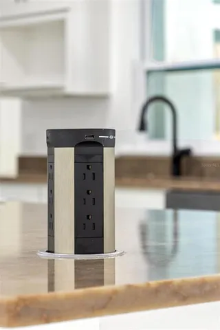 a view of large kitchen with a sink and a stove