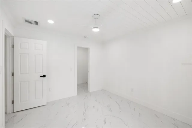 a view of a kitchen with a sink and a window